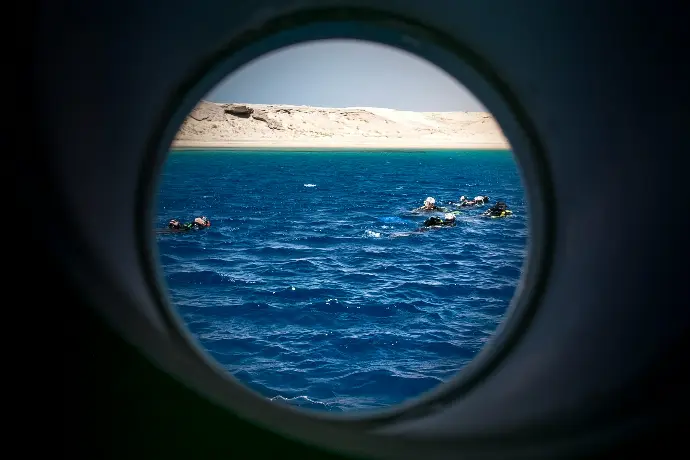 a view of a body of water through a round window